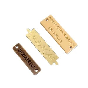 Custom Embossed Metal Nameplates Gold Bronze Tags with Holes for Swimwear and Clothing Branding